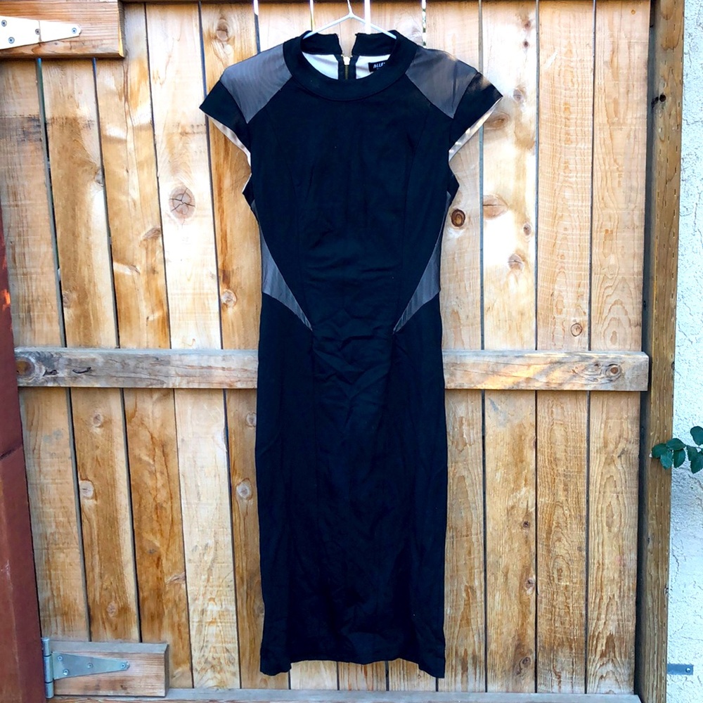 Midi black dress with shoulder pads can cut off